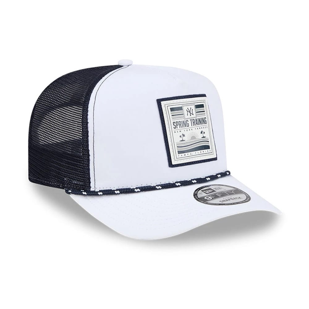 New York Yankees MLB Lines White New Era 9FIFTY A-Frame Snapback Adjustable Cap, three-quarter view showing a grey Spring Training patch on the front panel, black mesh side panels, and a 9FIFTY size sticker on the white curved visor.