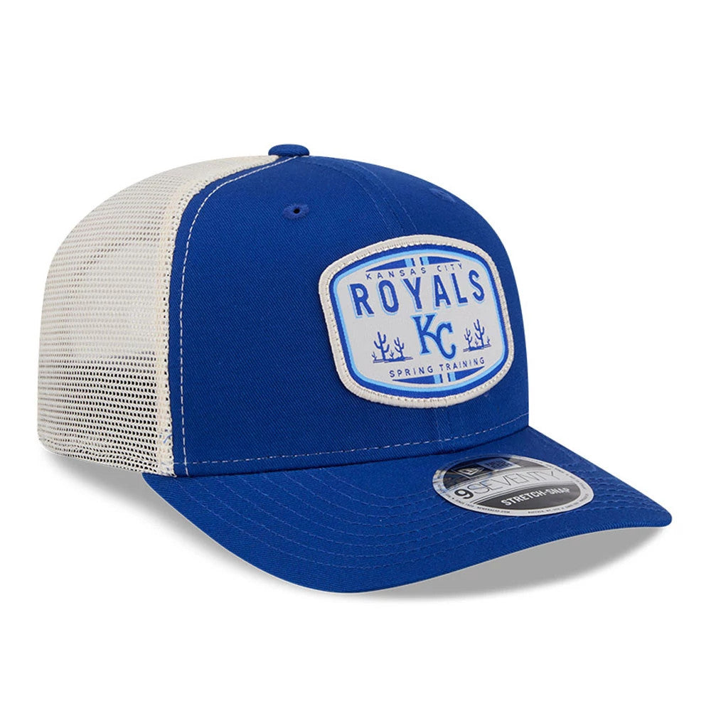 Kansas City Royals MLB Patch Blue New Era 9SEVENTY Stretch Snap Adjustable Cap, three-quarter view showing a white and blue embroidered patch logo on the front panel, blue curved visor with a 9SEVENTY size sticker, and white mesh back panels.