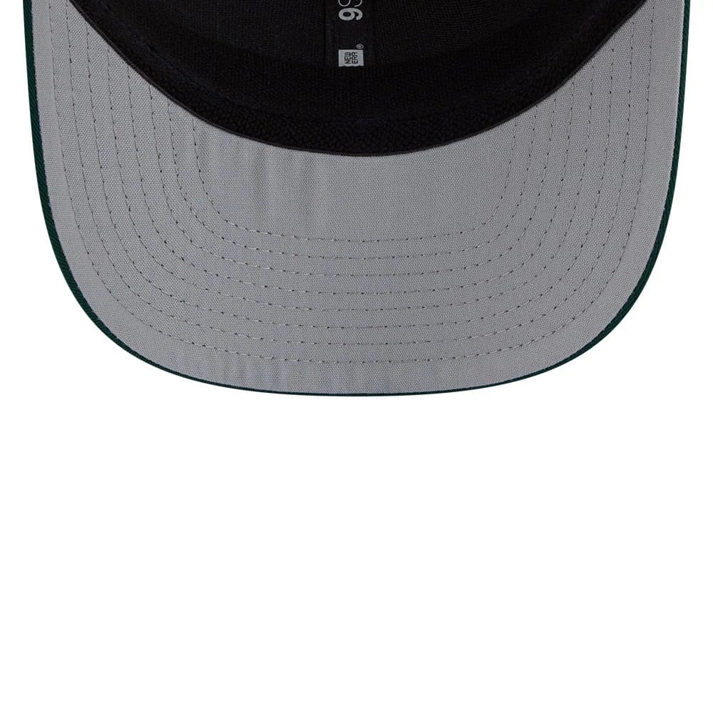 Athletics MLB Patch Dark Green New Era 9SEVENTY Stretch Snap Adjustable Cap, inside view showing the grey undervisor with black stitching and black-taped seams across the interior, highlighting the structured design.