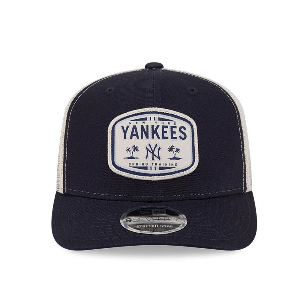 New York Yankees MLB Patch Navy New Era 9SEVENTY Stretch Snap Adjustable Cap, front view showing a white rectangular patch with blue Yankees text and palm trees on the structured navy crown, with a curved visor and 9SEVENTY size sticker.