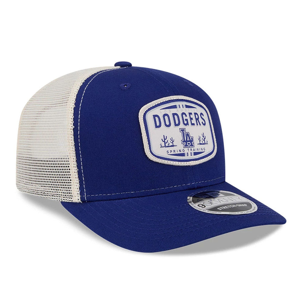 LA Dodgers MLB Patch Dark Blue New Era 9SEVENTY Stretch Snap Adjustable Cap, three-quarter view showing the white embroidered patch on the front panel with Dodgers lettering and LA logo, paired with a curved dark blue visor.