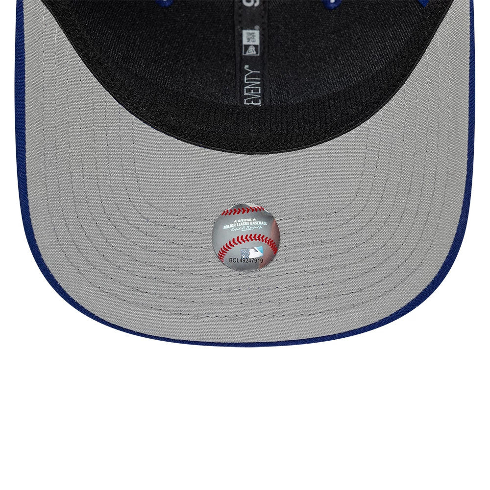 LA Dodgers MLB Circles Dark Blue New Era 9SEVENTY Stretch Snap Adjustable Cap, inside view showing black sweatband, grey undervisor, white taping with repeating text, and an MLB holographic sticker centred underneath the visor.
