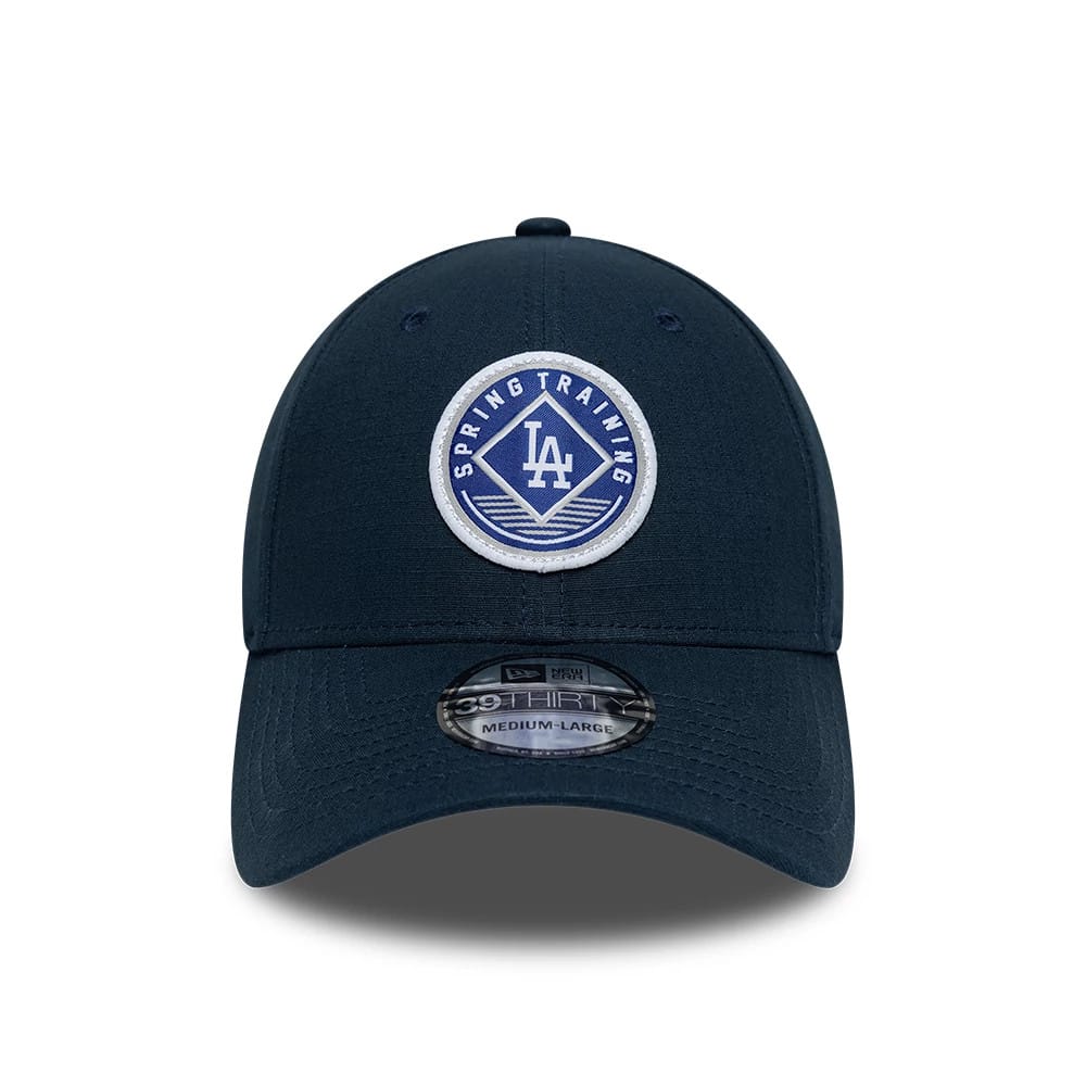 LA Dodgers MLB Ripstop Dark Blue New Era 39THIRTY Stretch Fit Cap, front view showing a circular blue and white Spring Training logo with LA lettering embroidered on the front panel and a 39THIRTY size sticker on the curved visor.