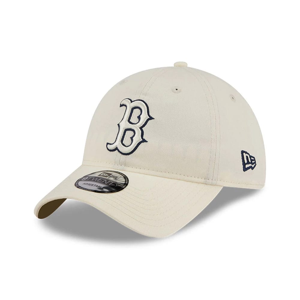 Boston Red Sox MLB Colours White New Era 9TWENTY Adjustable Cap, three-quarter view showing the raised navy embroidered B logo on the front panel, a curved visor with a 9TWENTY size sticker, and the New Era flag logo on the left side.