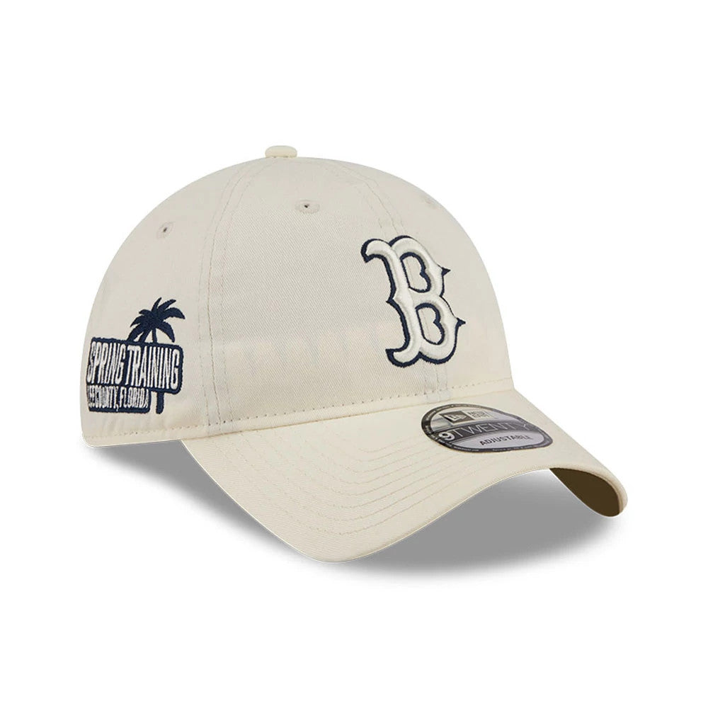 Boston Red Sox MLB Colours White New Era 9TWENTY Adjustable Cap, three-quarter view showing the raised white embroidered B logo on the front, curved visor with a grey 9TWENTY size sticker, and a Spring Training graphic on the left side.