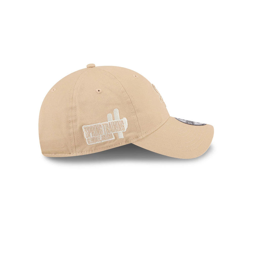 Chicago White Sox MLB Colours Light Beige New Era 9TWENTY Adjustable Cap, side view showing the white embroidered Spring Training graphic on the left side, with a curved beige visor and top button.