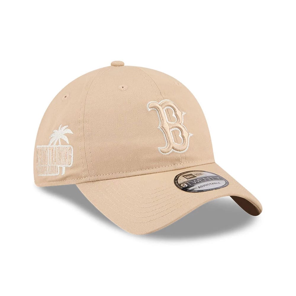 Boston Red Sox MLB Colours Light Beige New Era 9TWENTY Adjustable Cap, three-quarter view showing the raised white embroidered B logo on the front panel, curved visor with a 9TWENTY size sticker, and side palm tree logo embroidery.