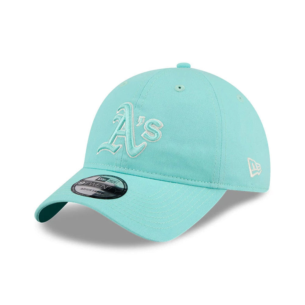 Athletics MLB Colours Turquoise New Era 9TWENTY Adjustable Cap, front view showing raised white embroidered A’s logo on the front panel, matching New Era flag logo on the left side, and black and grey 9TWENTY size sticker on the curved visor.