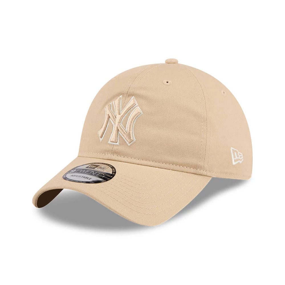 New York Yankees MLB Colours Light Beige New Era 9TWENTY Adjustable Cap, three-quarter view showing the raised beige New York Yankees logo on the front panel, with a curved visor and a 9TWENTY size sticker on the visor.