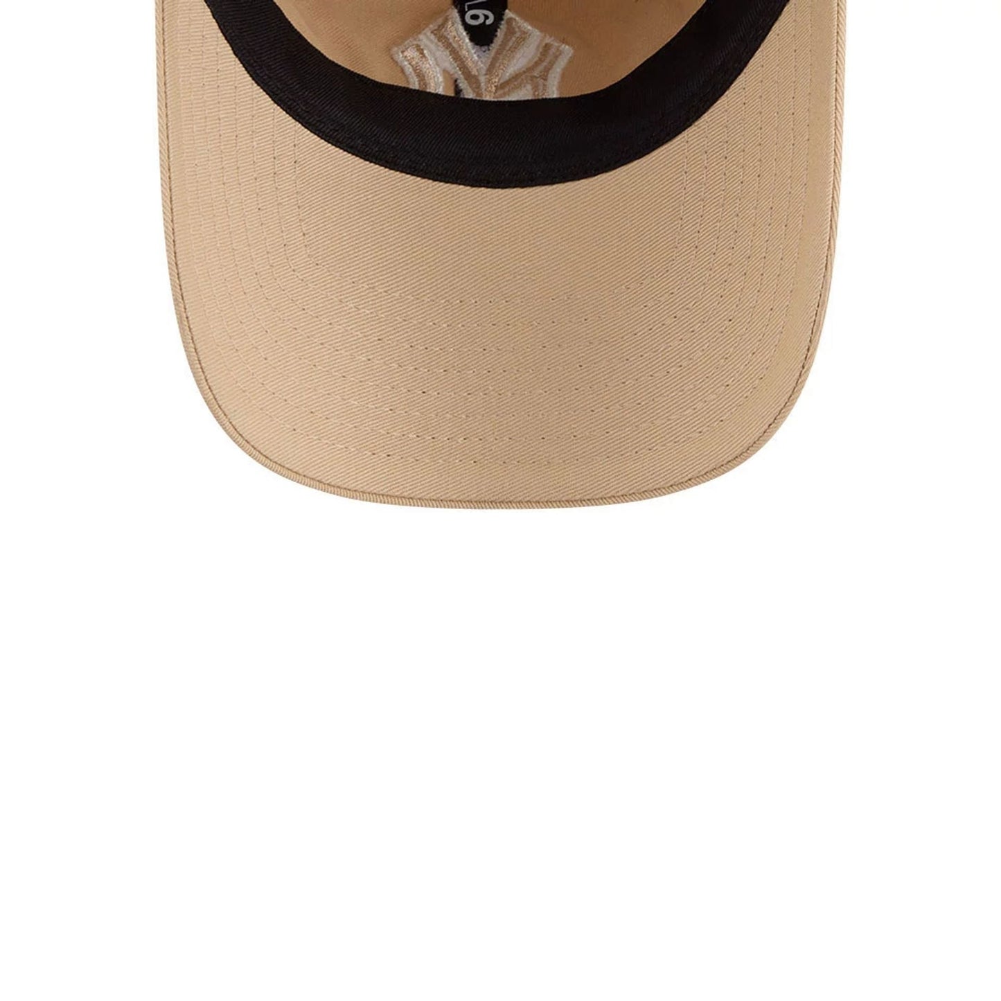 New York Yankees MLB Colours Light Beige New Era 9TWENTY Adjustable Cap, inside view showing the contrasting black sweatband, white taping with printed branding, and beige undervisor.