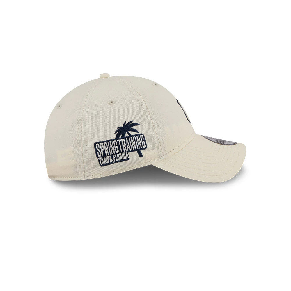 Yankees MLB Colours White New Era 9TWENTY Adjustable Cap, side view showing the navy spring training logo with a palm tree embroidered on the left panel and a curved white visor with a 9TWENTY size sticker.