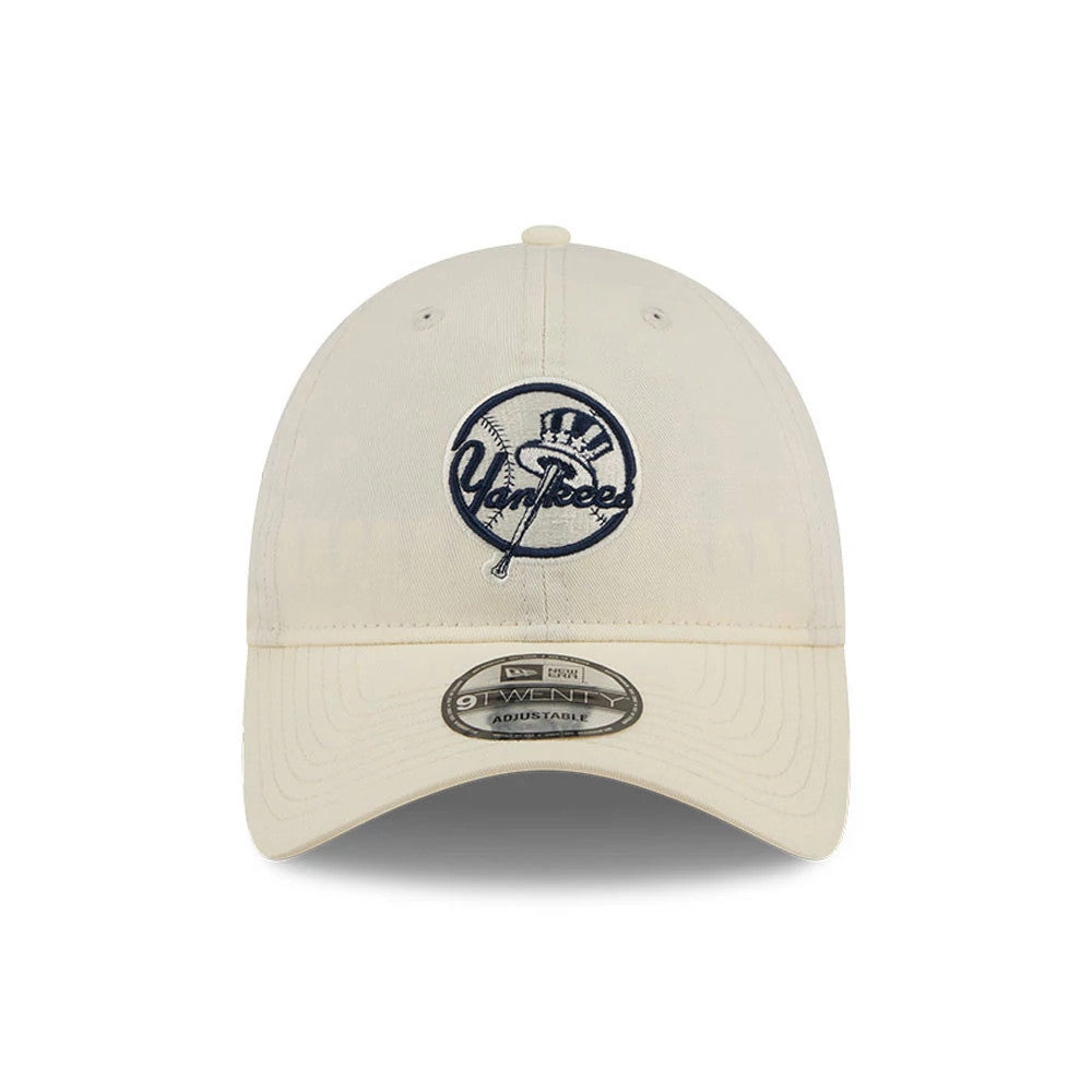 New York Yankees MLB Colours White New Era 9TWENTY Adjustable Cap, front view showing the navy Yankees logo with raised embroidery on the front panel, a curved visor and the 9TWENTY size sticker on the visor.