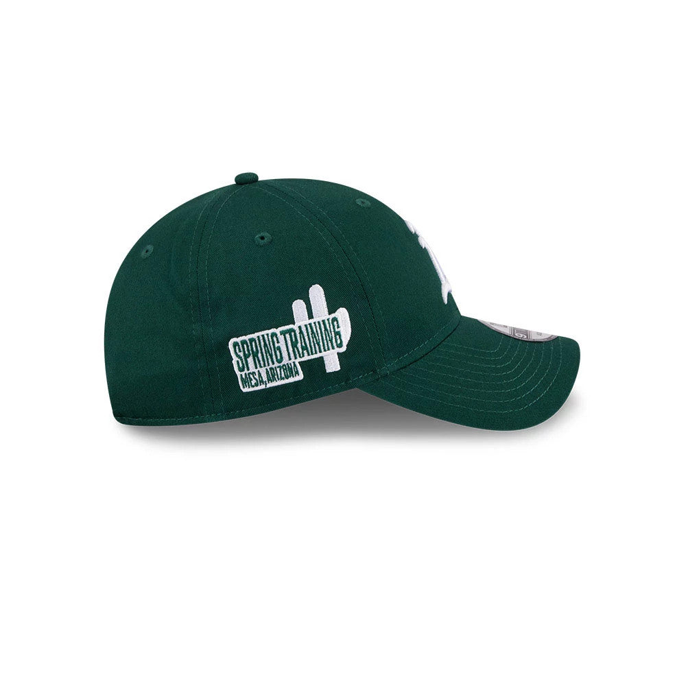 Athletics MLB Colours Dark Green New Era 9TWENTY Adjustable Cap, side view with an embroidered white Spring Training Mesa, Arizona logo on the side, showing a curved visor and matching dark green eyelets.