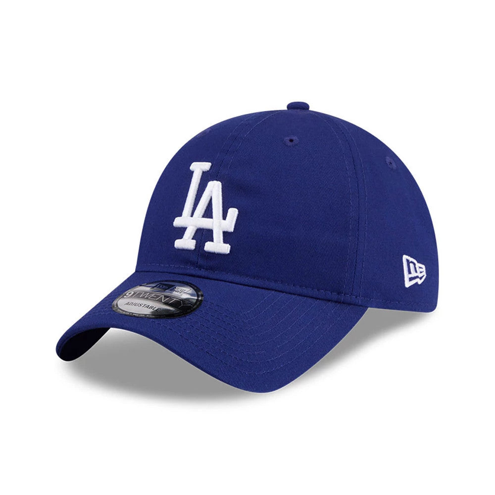 LA Dodgers MLB Colours Dark Blue New Era 9TWENTY Adjustable Cap, three-quarter view showing the raised white LA logo embroidered on the front panel, curved visor with a 9TWENTY size sticker, and New Era flag logo on the left side.