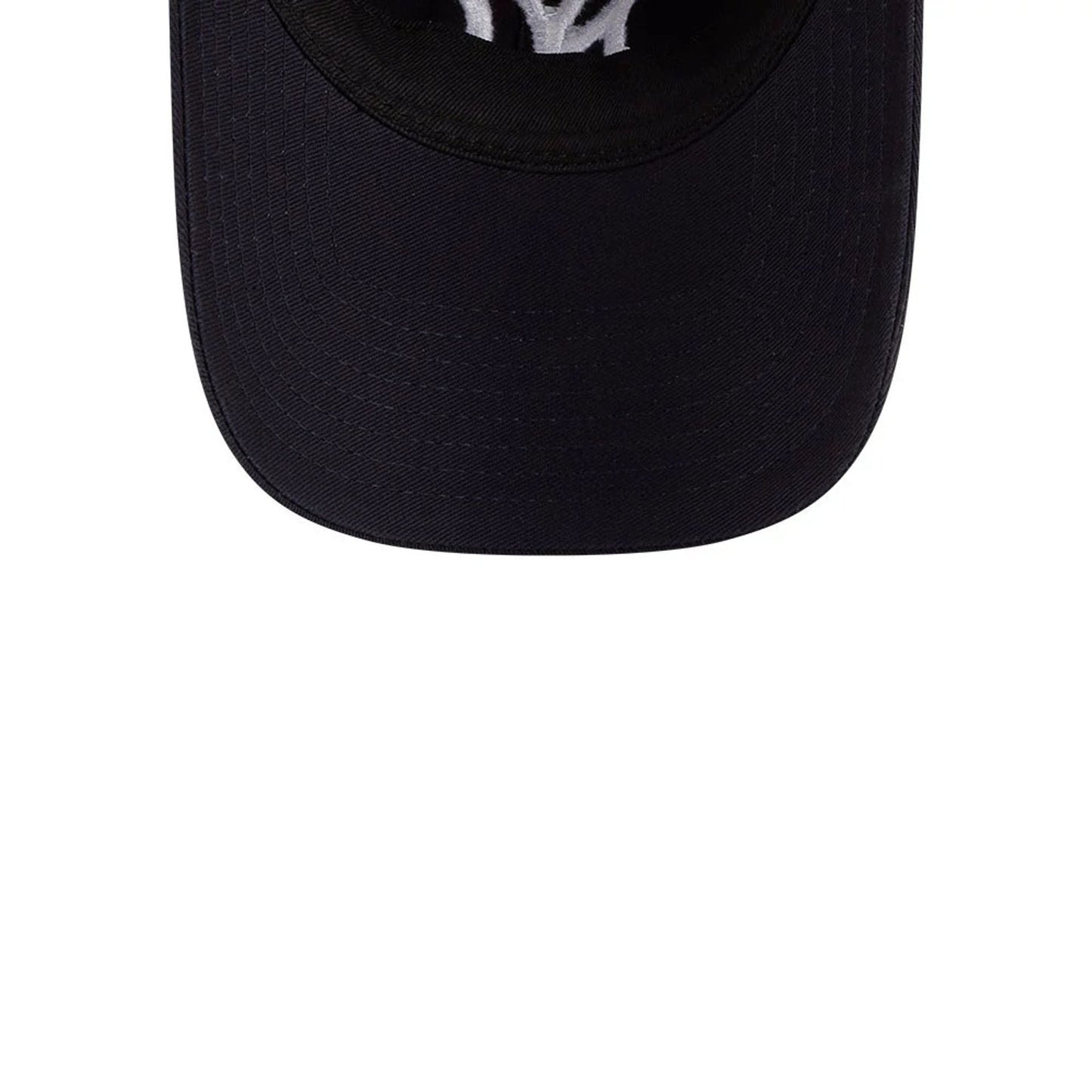 Yankees MLB Colours Navy New Era 9TWENTY Adjustable Cap, top view showing the curved navy visor and white NY logo embroidery prominently on the front panel, blending seamlessly with the dark fabric.
