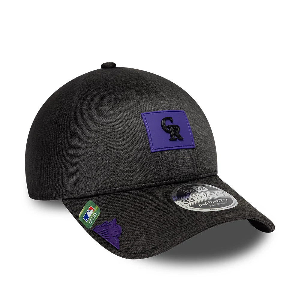 Colorado Rockies MLB Clubhouse Black New Era 39THIRTY Infinity Stretch Fit Cap, three-quarter view showing the purple team logo on the front panel, the 39THIRTY size sticker on the black curved visor and additional logos on the left side.