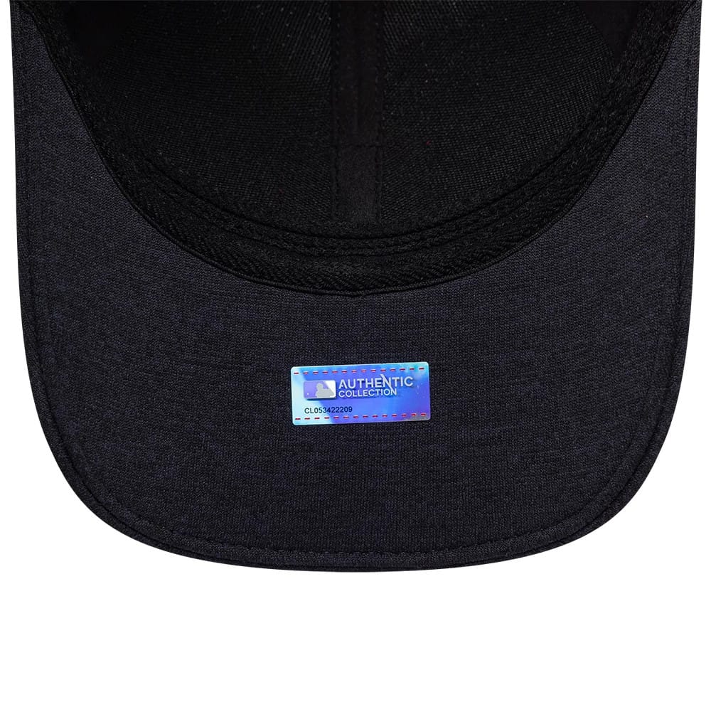 Minnesota Twins MLB Clubhouse Navy New Era 39THIRTY Infinity Stretch Fit Cap, inside view showing the navy undervisor with an Authentic Collection holographic sticker and black interior taping along the crown seams.