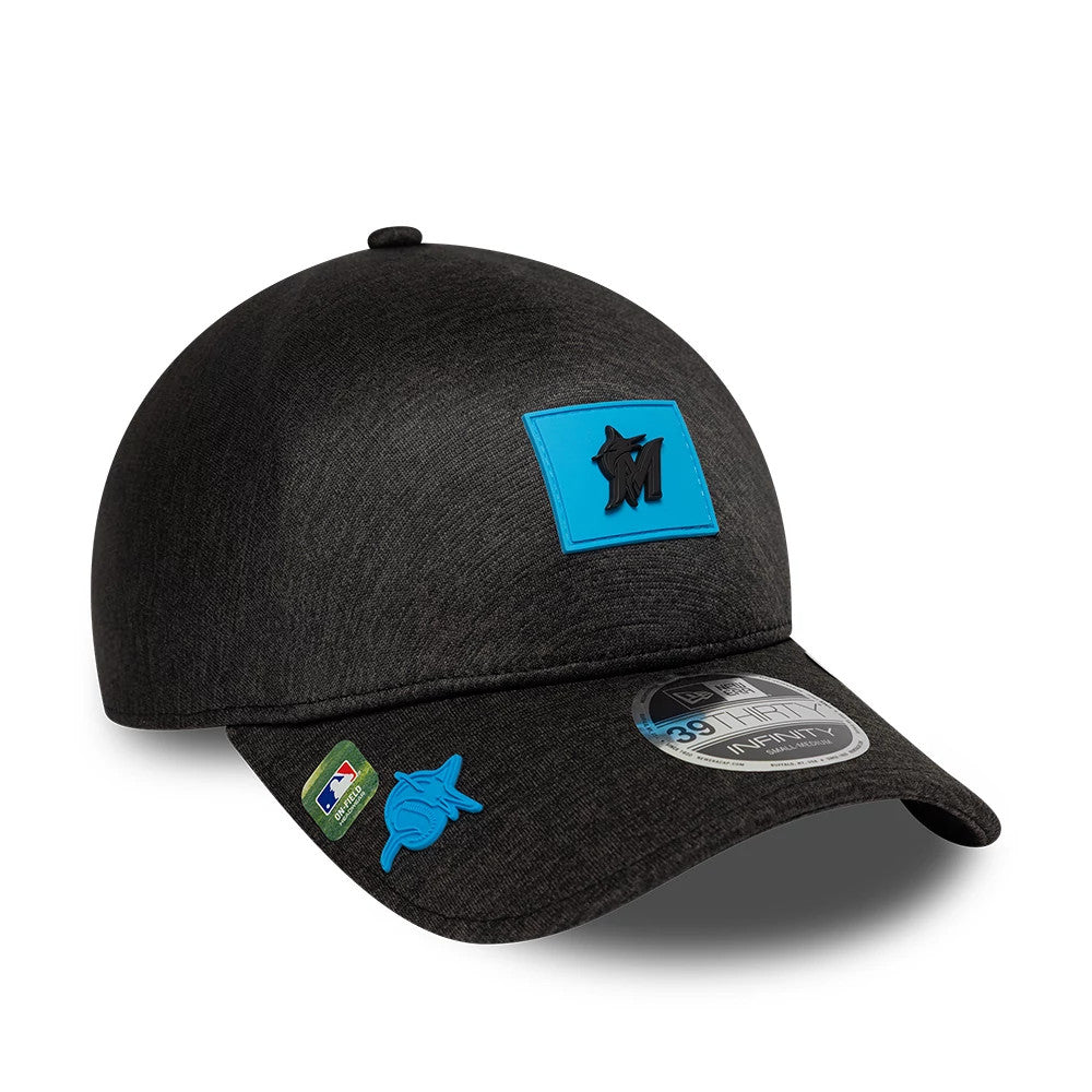 Miami Marlins MLB Clubhouse Black New Era 39THIRTY Infinity Stretch Fit Cap, front view showing a black and blue logo patch on the front panel, with a curved black visor and a grey 39THIRTY size sticker.