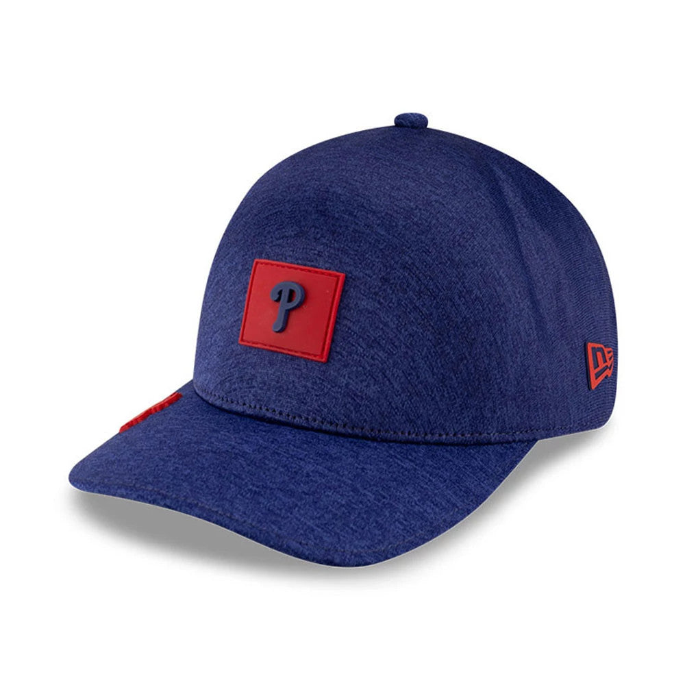 Philadelphia Phillies MLB Clubhouse Red New Era 39THIRTY Infinity Stretch Fit Cap, three-quarter view showing a raised red square patch with a dark blue Phillies logo on the front panel and a red New Era flag logo embroidered on the left side.