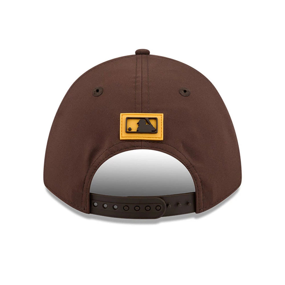 San Diego Padres MLB Clubhouse Dark Brown New Era 9FORTY M-Crown A-Frame Adjustable Cap, rear view showing the raised MLB Batterman logo in yellow and brown at the centre back, with a dark brown adjustable strap.