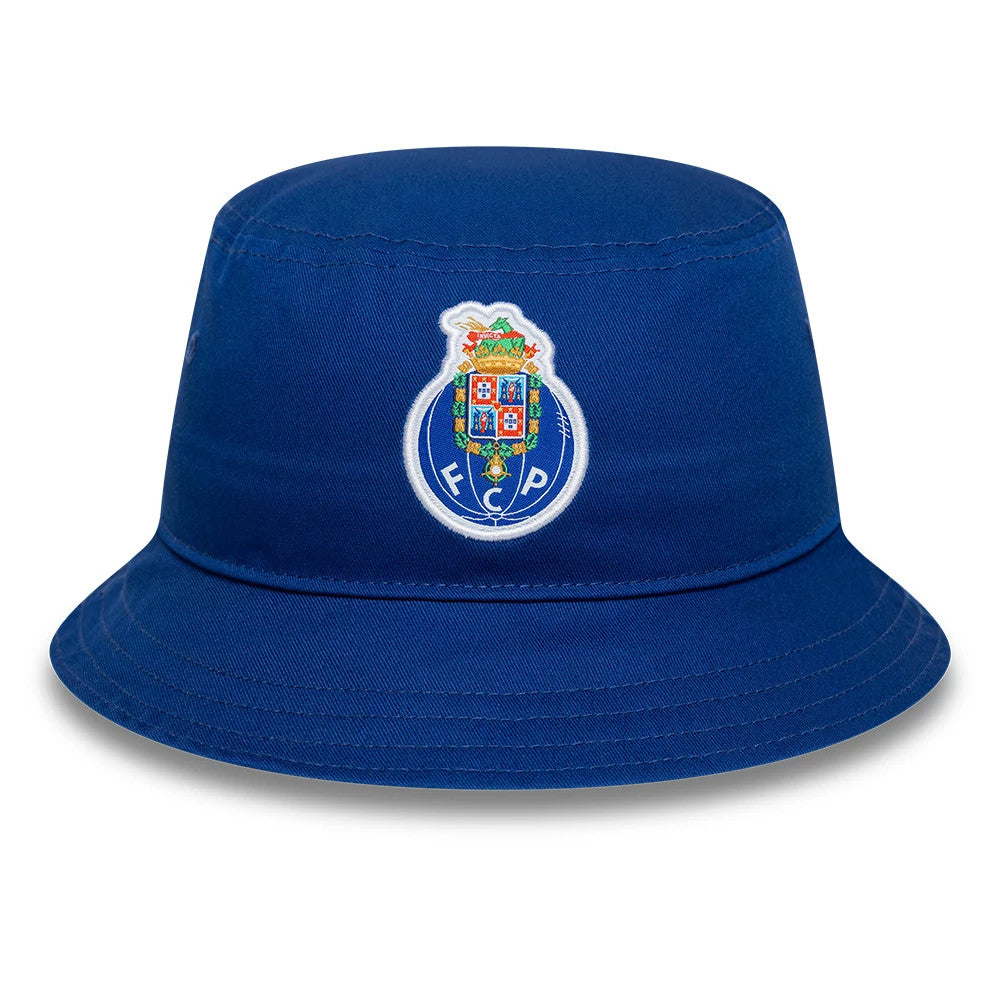 New Era FC Porto Core Blue Tapered Bucket Hat, front view showing the embroidered FC Porto crest logo on the structured blue crown, with a downward-sloping visor and detailed stitching around the edge.