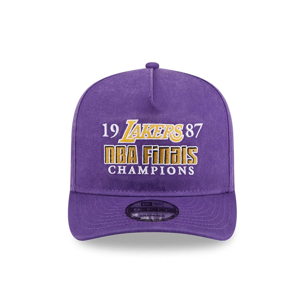 LA Lakers NBA Historic Purple New Era 9FIFTY A-Frame Snapback Adjustable Cap, front view showing the raised gold and white embroidered 1987 NBA Finals Champions text and Lakers logo on the structured purple crown.