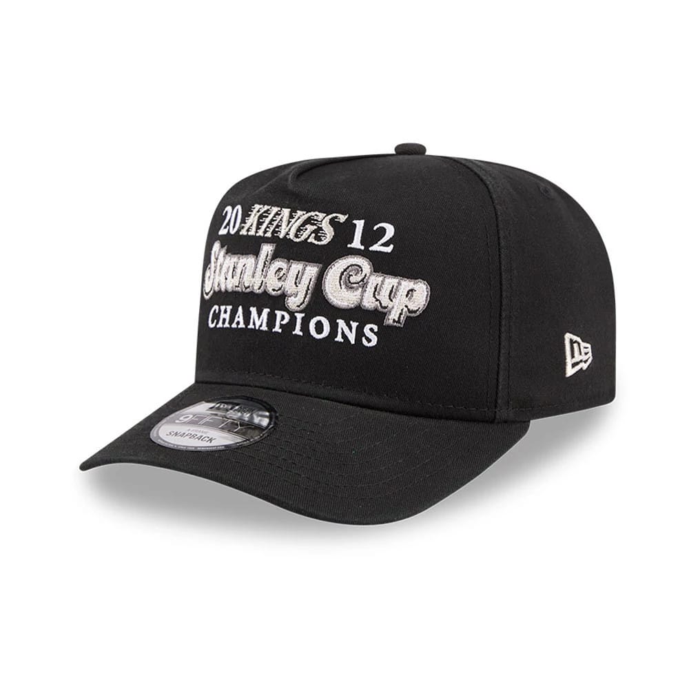 LA Kings NHL Historic Black New Era 9FIFTY A-Frame Snapback Adjustable Cap, three-quarter view showing grey raised embroidered lettering on front panels, black flat visor with 9FIFTY size sticker, and New Era flag logo on the left side.