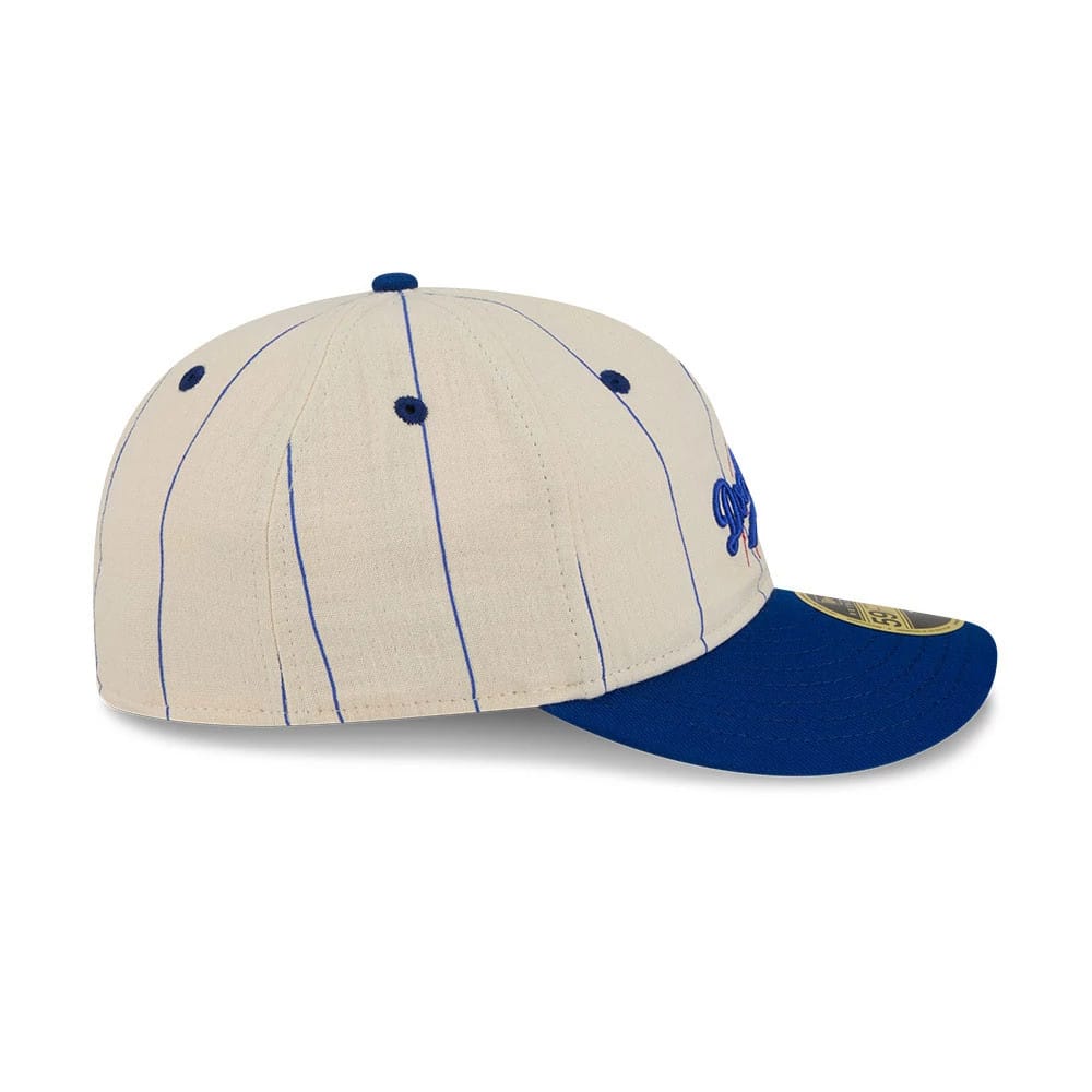 LA Dodgers MLB Linen Black Retro Crown New Era 59FIFTY Fitted Cap, side view showing the blue embroidered Dodgers logo on the front panel, blue pinstripes, a matching blue curved visor, and a gold 59FIFTY size sticker.