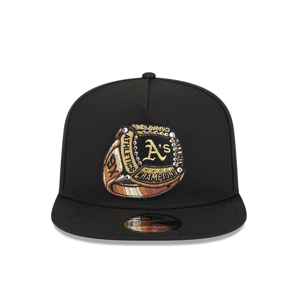 Athletics MLB Ring Black New Era 9FIFTY A-Frame Snapback Adjustable Cap, front view showing the detailed gold embroidered championship ring graphic on the structured black crown, with a black flat visor and 9FIFTY size sticker.