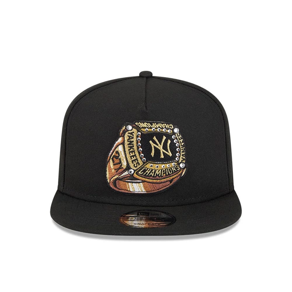 New York Yankees MLB Ring Black New Era 9FIFTY A-Frame Snapback Adjustable Cap, front view showing a gold and black embroidered championship ring graphic on the front panel, with a flat black visor and a 9FIFTY size sticker on the visor.