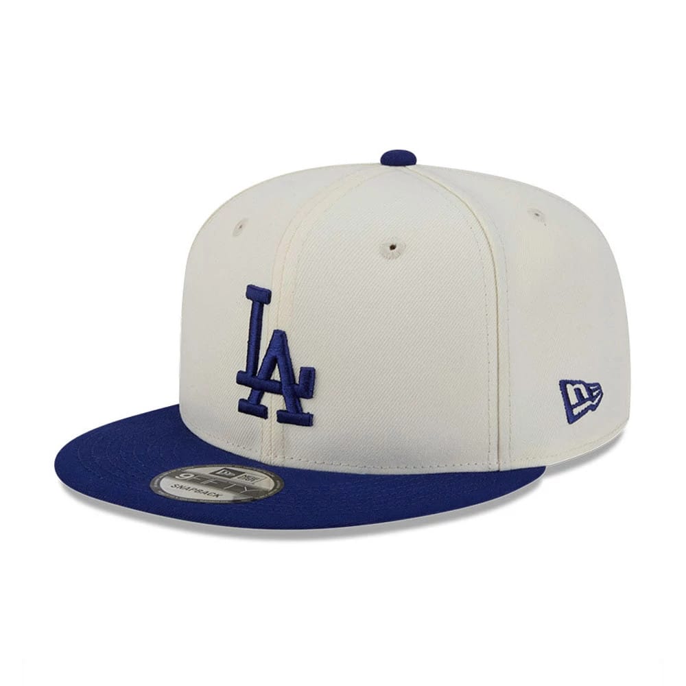 LA Dodgers MLB Localized White New Era 9FIFTY Snapback Adjustable Cap, front view showing the blue raised embroidered LA logo on the front panel, with a contrasting blue visor and a silver 9FIFTY size sticker.