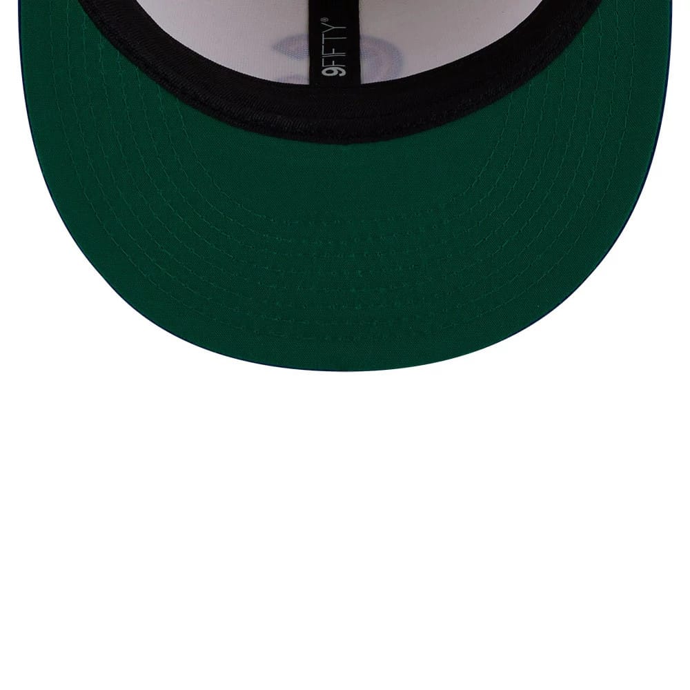 Chicago Cubs MLB Localized White New Era 9FIFTY Snapback Adjustable Cap, inside view showing a dark green undervisor, black sweatband, and black taping with 9FIFTY lettering, against a white interior crown.