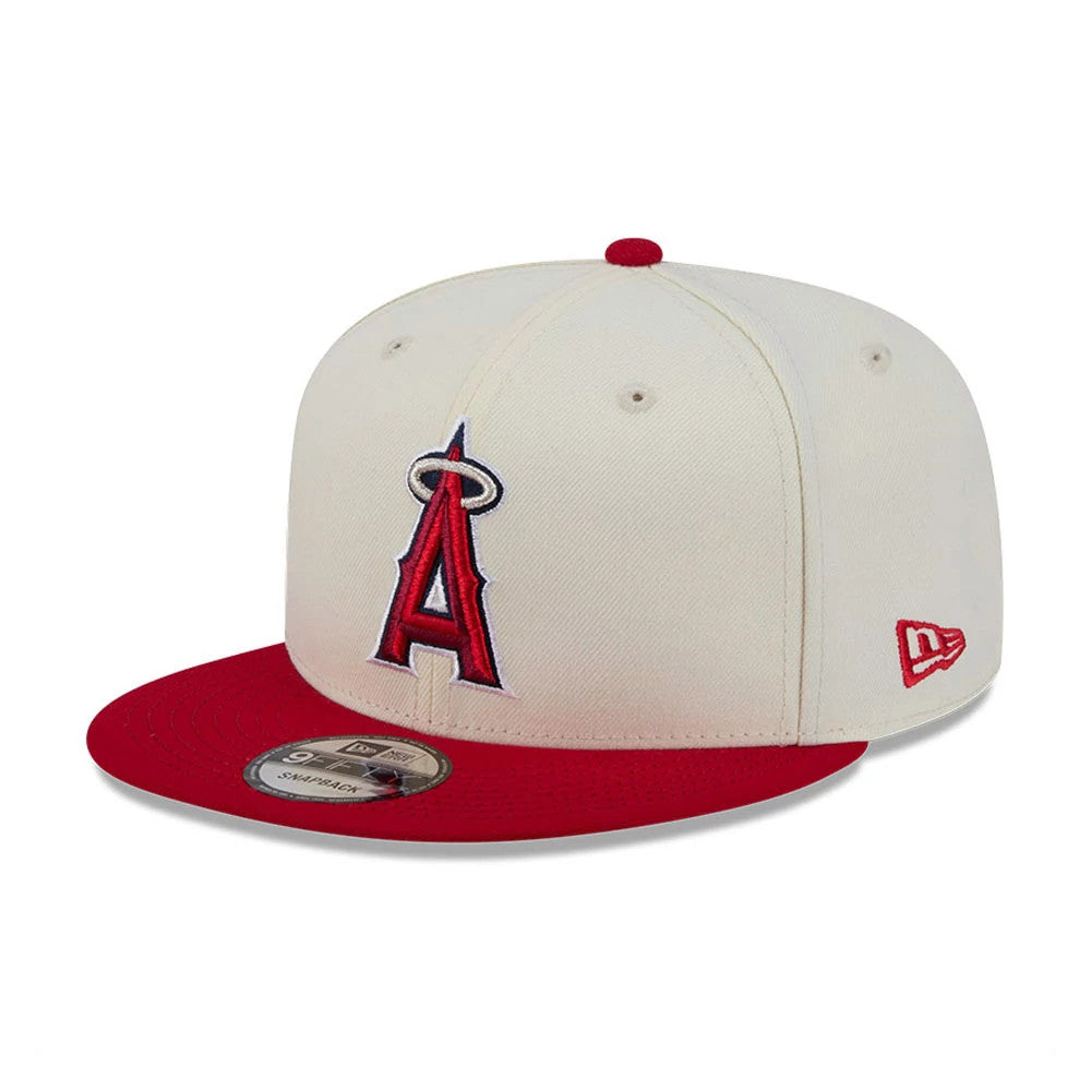LA Angels MLB Localized White New Era 9FIFTY Snapback Adjustable Cap, three-quarter view showing a raised red and white embroidered A logo on the front panel, red flat visor with a 9FIFTY size sticker, and New Era flag logo on the left side.
