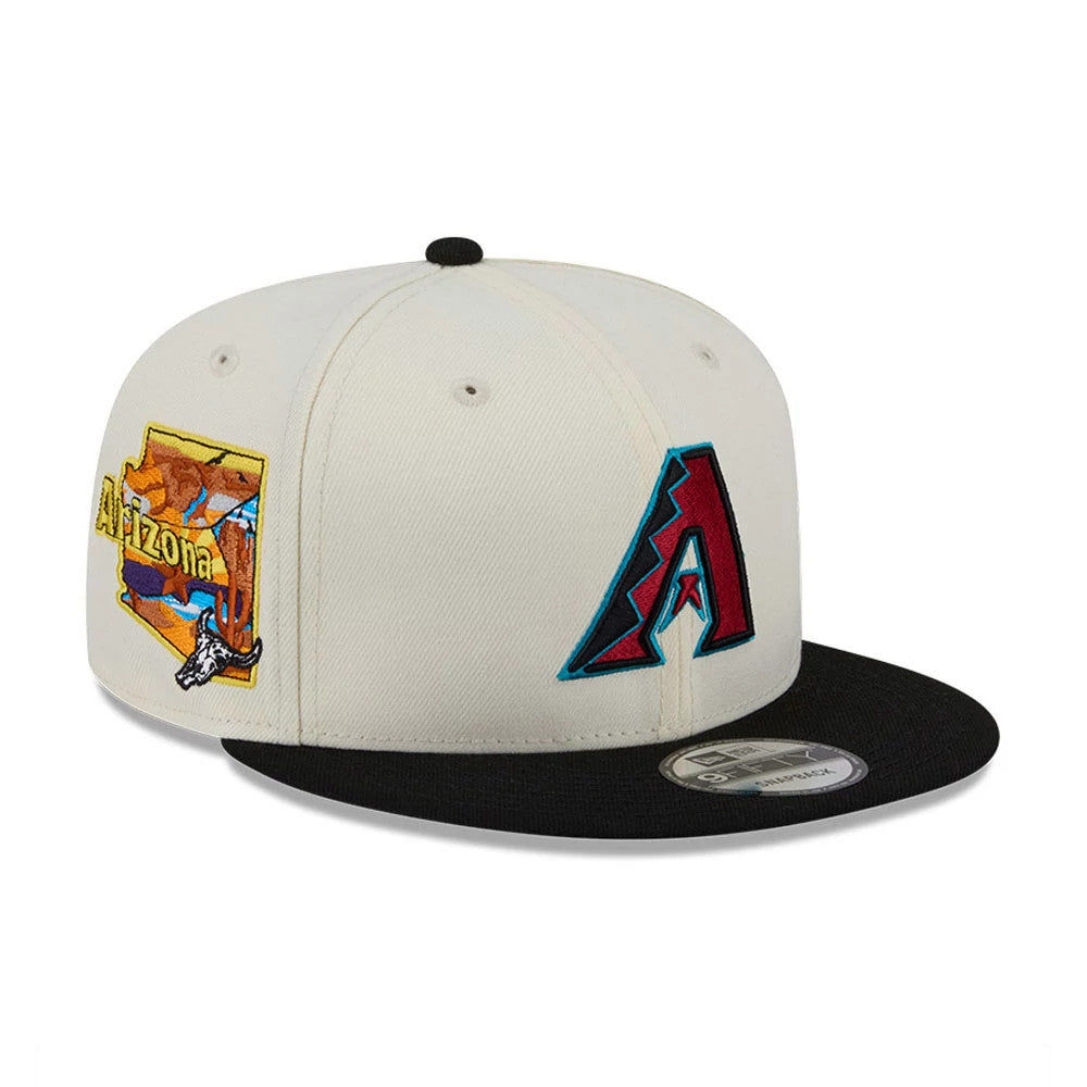 Arizona Diamondbacks MLB Localized White New Era 9FIFTY Snapback Adjustable Cap, three-quarter view with burgundy embroidered A logo, Arizona graphic on the side, and a black flat visor with a 9FIFTY size sticker.