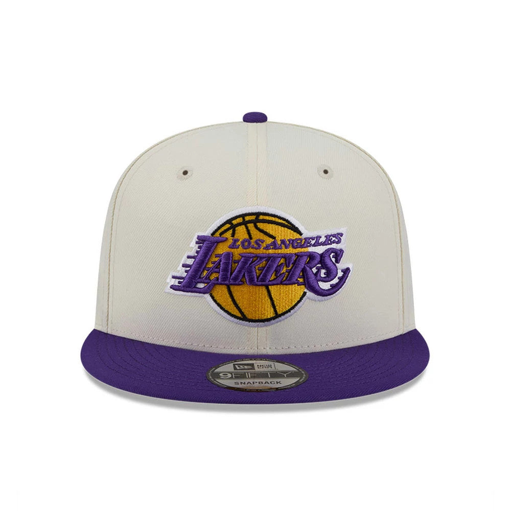 LA Lakers NBA Localized White New Era 9FIFTY Snapback Adjustable Cap, front view showing purple and gold raised embroidered Lakers logo on the white front panel, with a flat purple visor and a 9FIFTY size sticker.
