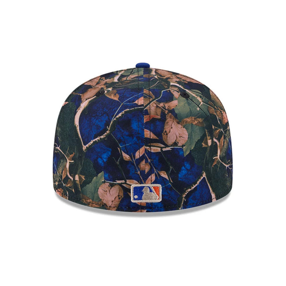 New York Mets MLB Leaves Blue New Era 59FIFTY Fitted Cap, rear view showing the embroidered MLB Batterman logo at the centre of the back panels, with a detailed leaf pattern in shades of green, brown, and blue covering the structured crown.