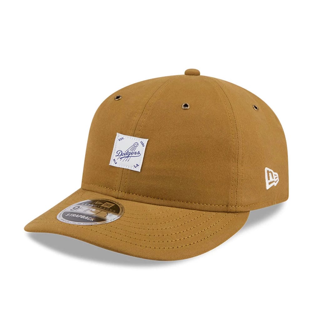 LA Dodgers MLB Brushed Dark Beige Retro Crown New Era 9FIFTY Adjustable Cap, three-quarter view showing a white logo patch on the front panel, a matching visor with a size sticker, and the New Era flag logo on the left side.