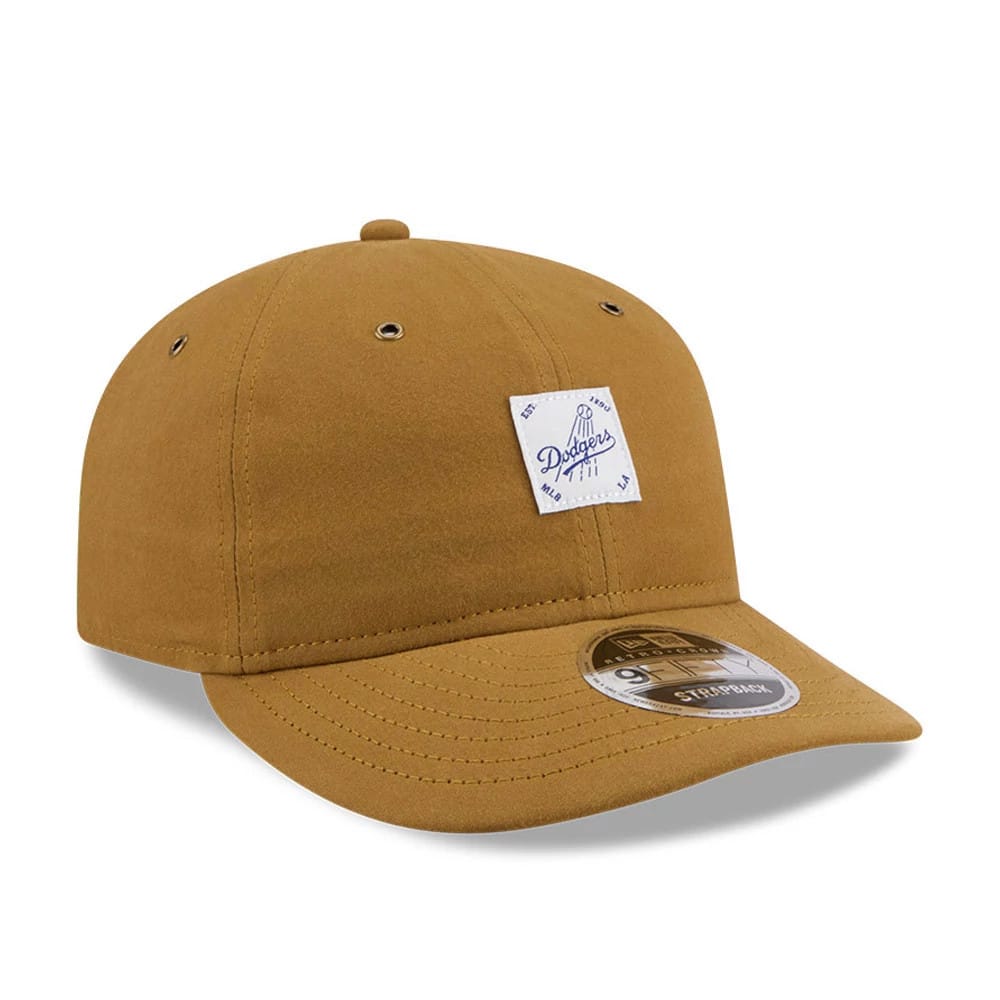 LA Dodgers MLB Brushed Dark Beige Retro Crown New Era 9FIFTY Adjustable Cap, front view showing a white and blue Dodgers patch on the front panel, a curved visor with silver 9FIFTY size sticker, and eyelets on the crown.
