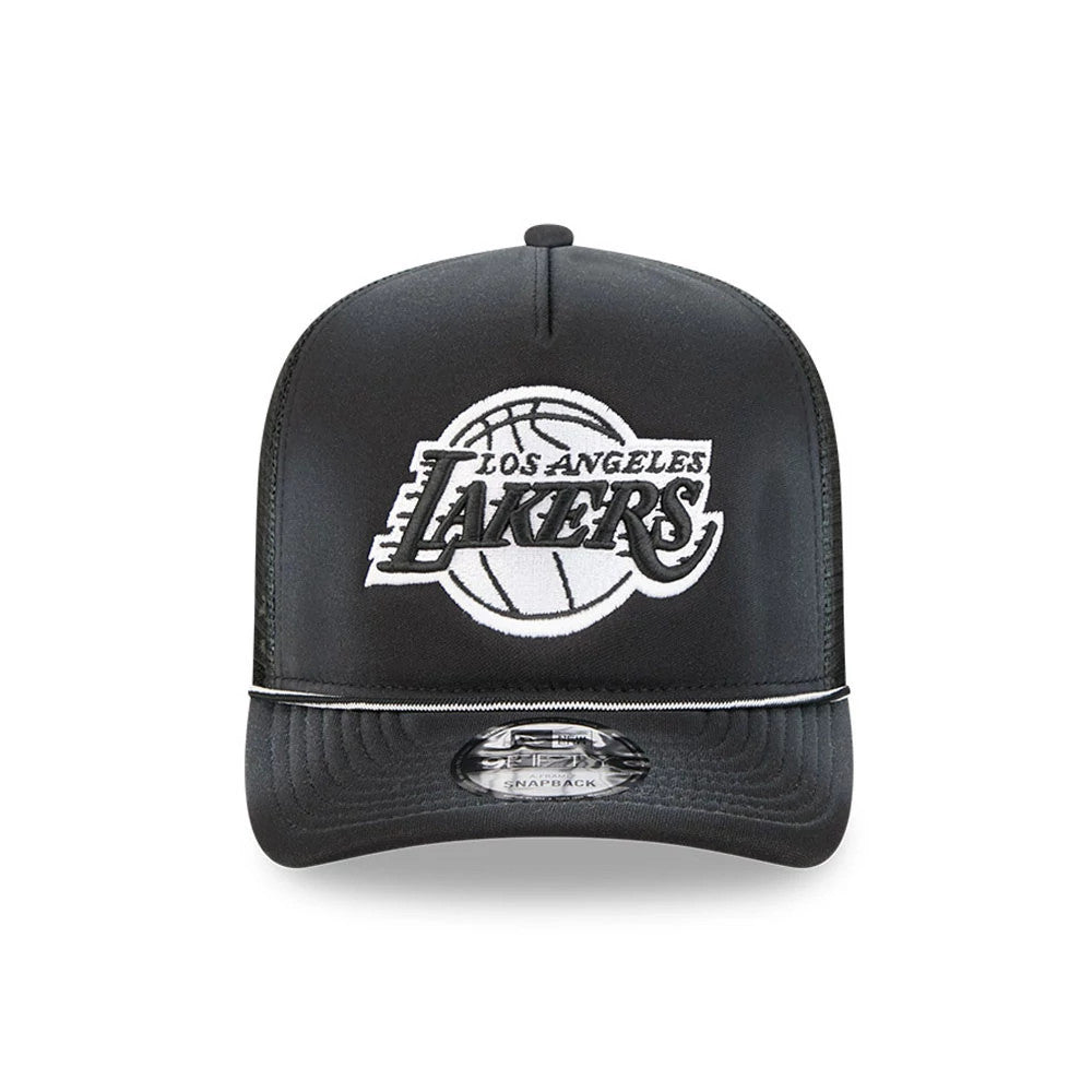 LA Lakers NBA Washed Black New Era 9FIFTY A-Frame Trucker Adjustable Cap, front view showing raised white and black embroidered Lakers text with basketball graphic on the front panel, flat black visor with grey 9FIFTY size sticker.