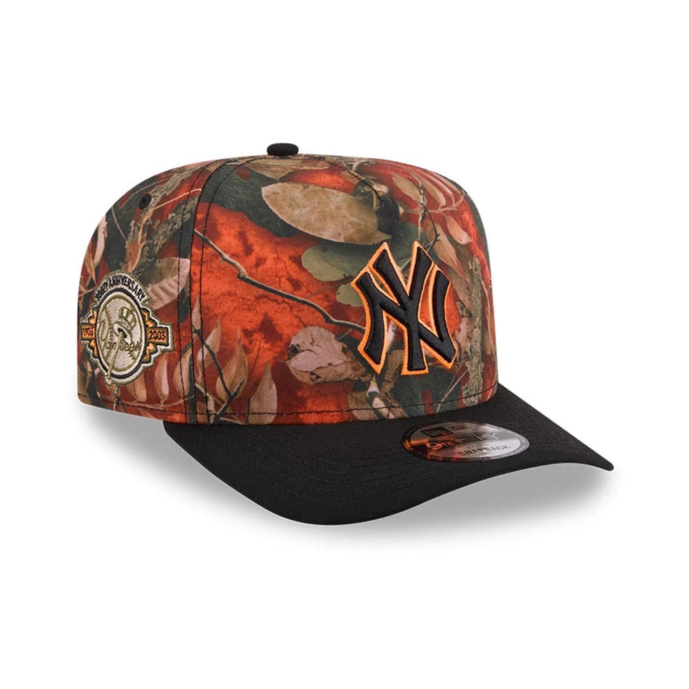 New York Yankees MLB Leaves Bright Orange New Era 9FIFTY A-Frame Snapback Cap, three-quarter view showing an orange embroidered NY logo on the front panel with a black flat visor and a commemorative side patch.