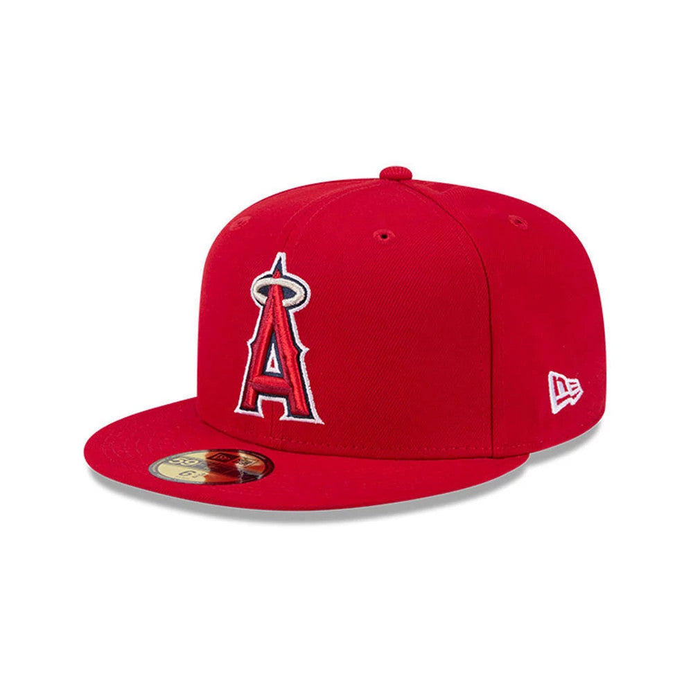 LA Angels MLB Hidden Hit Red New Era 59FIFTY Fitted Cap, three-quarter view showing the raised white and red embroidered Angels logo on the front panel, flat red visor with a gold 59FIFTY size sticker, and New Era flag logo on the left side.