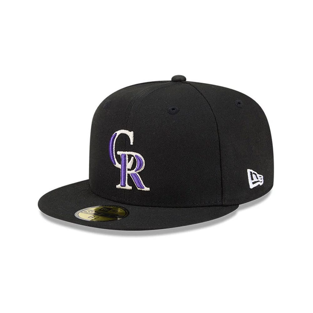 Colorado Rockies MLB Hidden Hit Black New Era 59FIFTY Fitted Cap, three-quarter view showing the white and purple embroidered Rockies logo on the front panel, black flat visor with gold 59FIFTY size sticker.