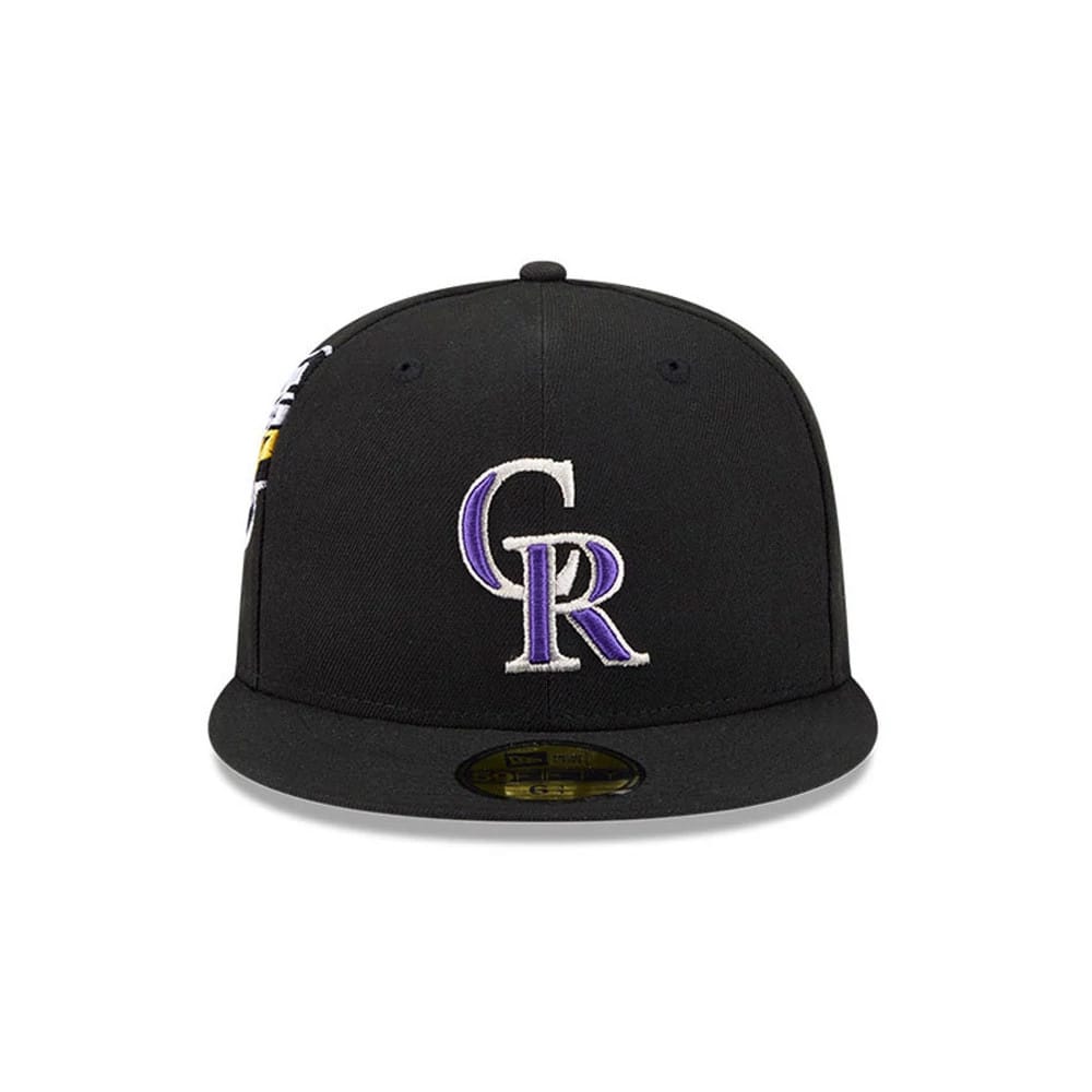 Colorado Rockies MLB Hidden Hit Black New Era 59FIFTY Fitted Cap, front view showing the raised white and purple embroidered CR logo on the structured black crown and the gold 59FIFTY size sticker on the flat black visor.