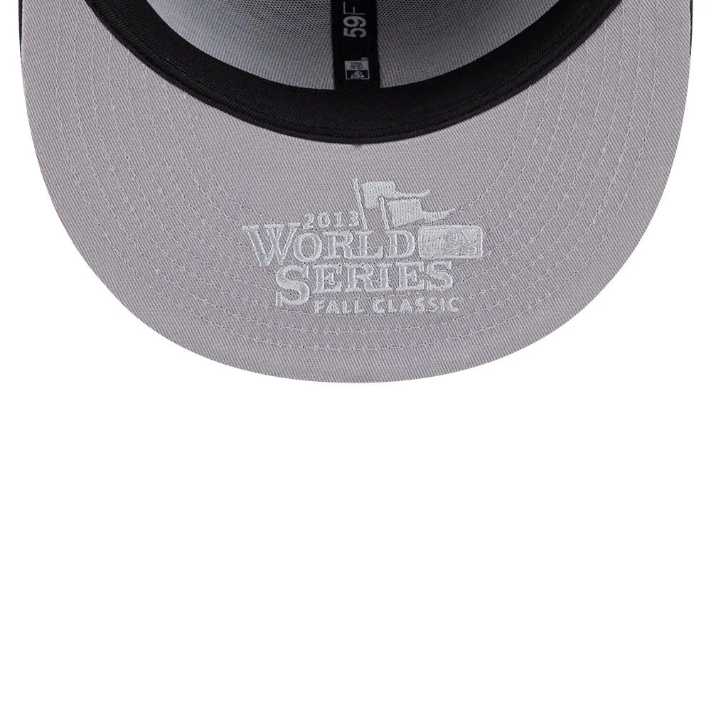 Boston Red Sox MLB Hidden Hit Navy New Era 59FIFTY Fitted Cap, inside view showing the grey undervisor with white embroidered 2013 World Series Fall Classic graphics, and black taping along the seams.