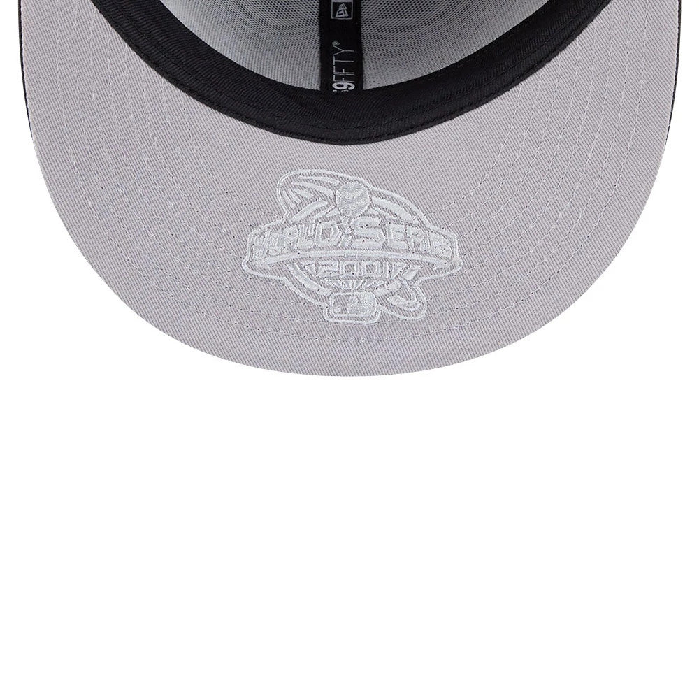 Arizona Diamondbacks MLB Hidden Hit Black New Era 59FIFTY Fitted Cap, inside view showing grey undervisor with embroidered World Series logo, black sweatband with size tag, and black New Era logo taping along the seams.