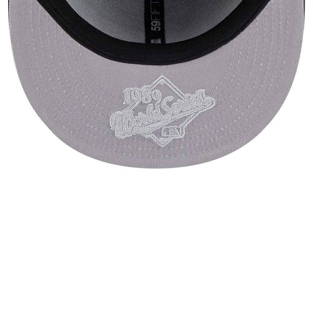 Pictured is this MLB Hidden Hit Athletics 59FIFTY Fitted cap in dark green. 2