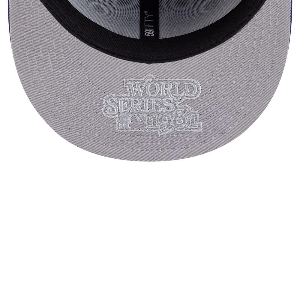 LA Dodgers MLB Hidden Hit Dark Blue New Era 59FIFTY Fitted Cap, inside view showing the grey undervisor with white World Series 1981 embroidery, black sweatband, and black 59FIFTY taping along the central seam.