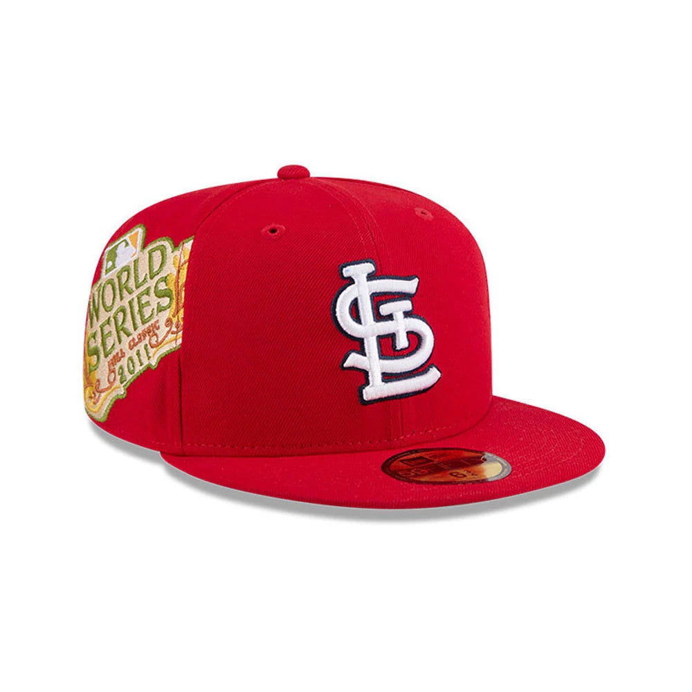 St. Louis Cardinals MLB Hidden Hit Red New Era 59FIFTY Fitted Cap, three-quarter view showing a white embroidered team logo on the front panel, a yellow World Series patch on the right side, and a gold 59FIFTY size sticker on the flat red visor.