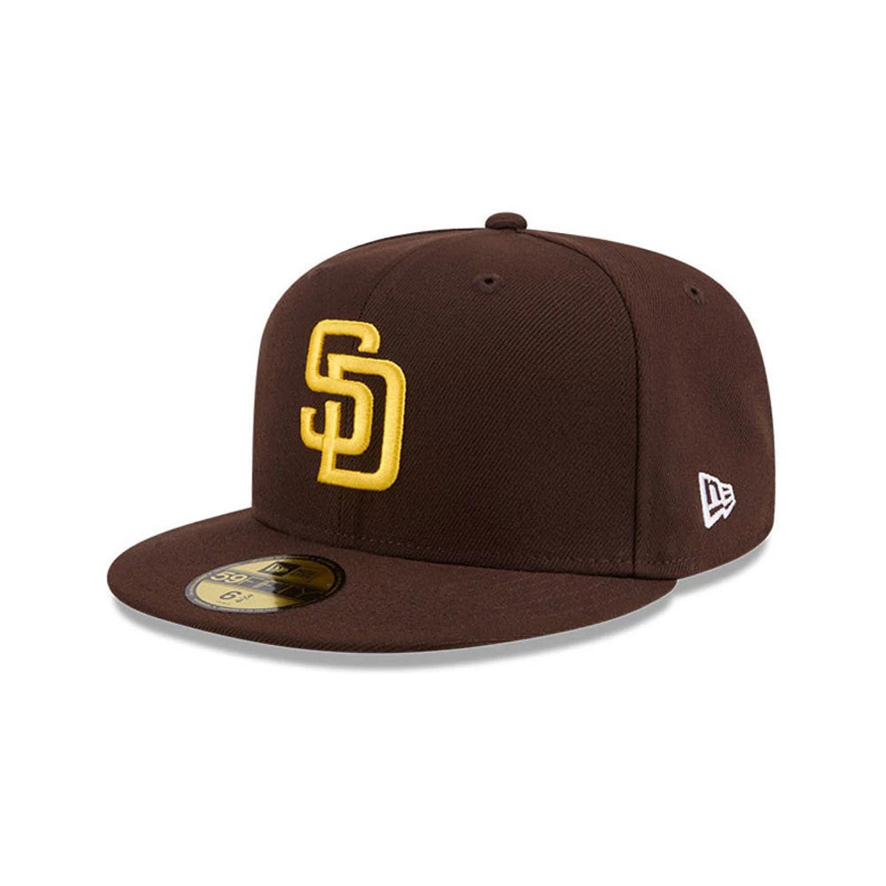 San Diego Padres MLB Hidden Hit Dark Brown New Era 59FIFTY Fitted Cap, three-quarter view showing the raised embroidered yellow SD logo on the front panel, with the New Era flag logo on the left side.