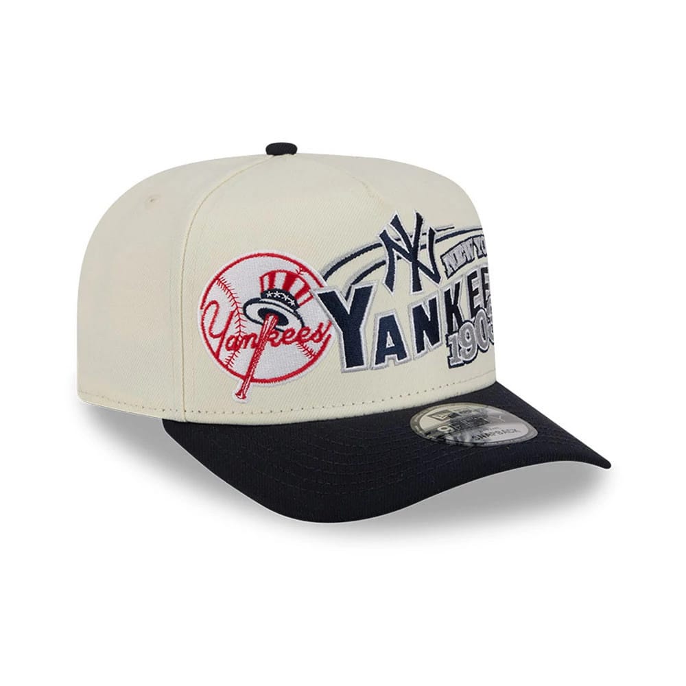 New York Yankees MLB Classic Cream New Era 9FIFTY A-Frame Snapback Adjustable Cap, three-quarter view featuring raised navy Yankees graphics and red baseball logo on the cream front, with a black flat visor and 9FIFTY size sticker.